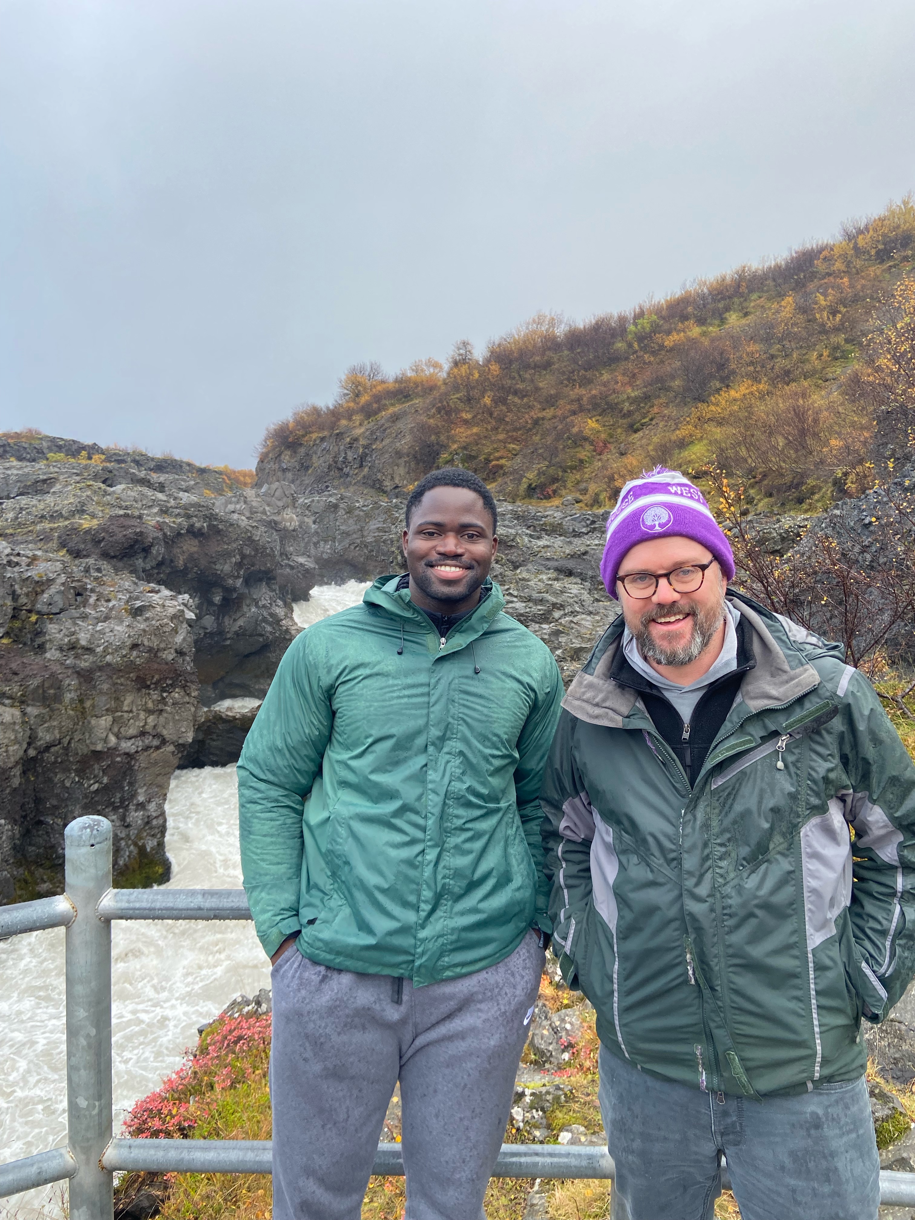 Picture with my Advisor, Ryan Hickox, next to a water fall in iceland